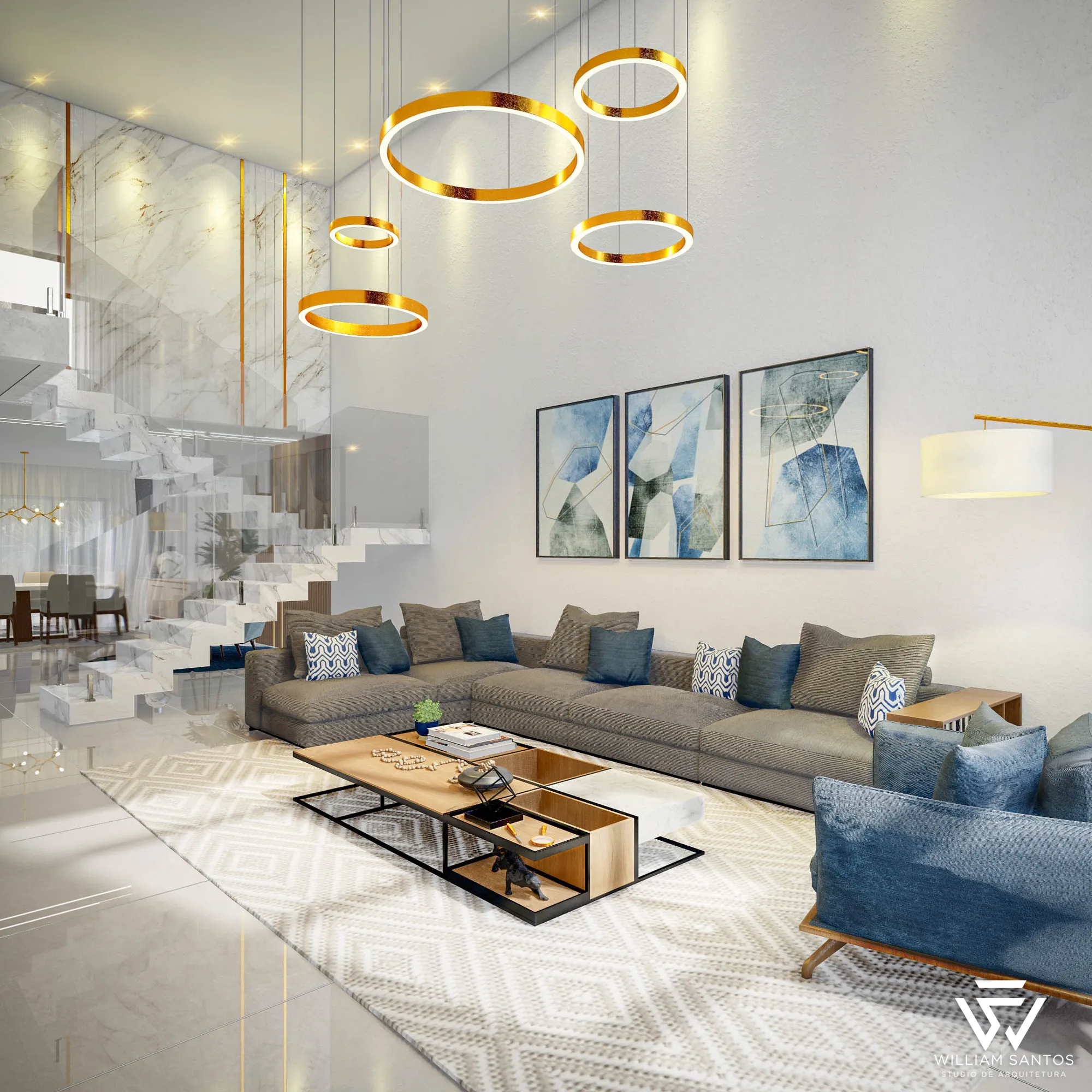 Sala de estar com pé-direito duplo, escada e lustres de anéis dourados