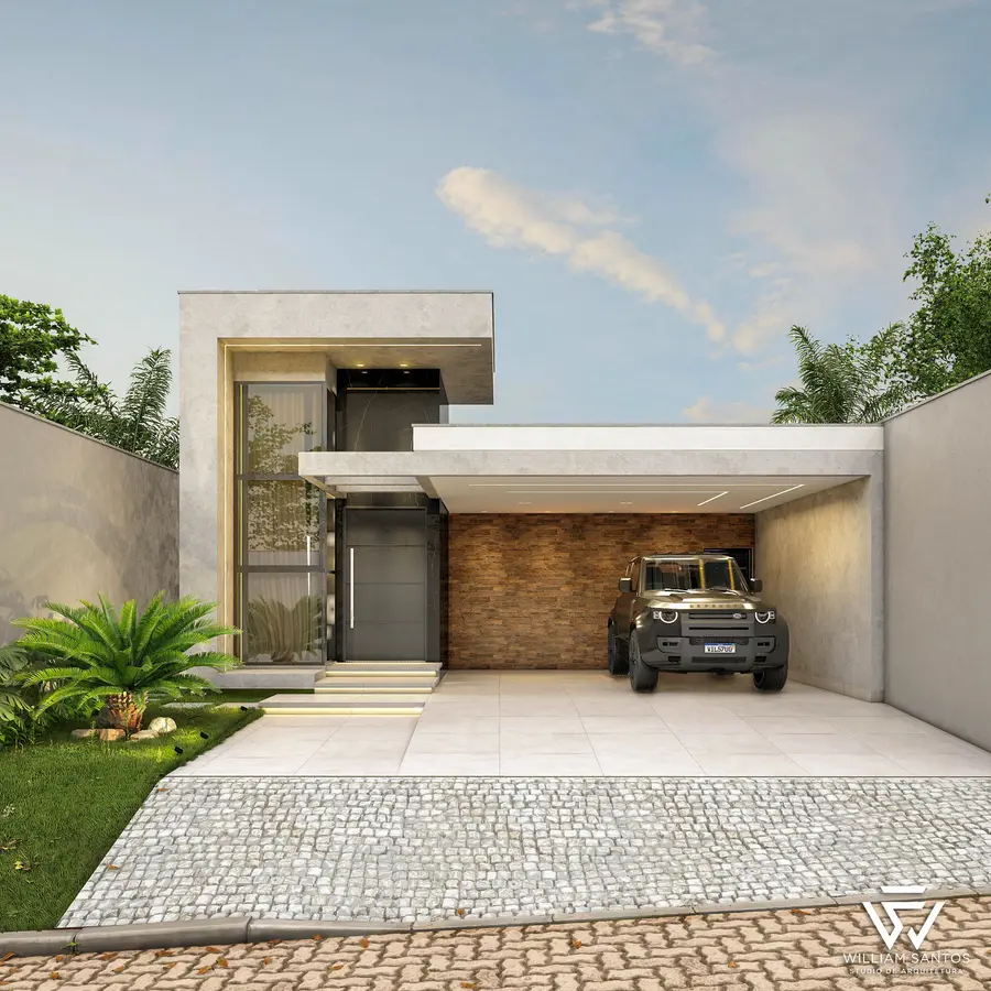 Residência com volume de tijolo aparente e garagem