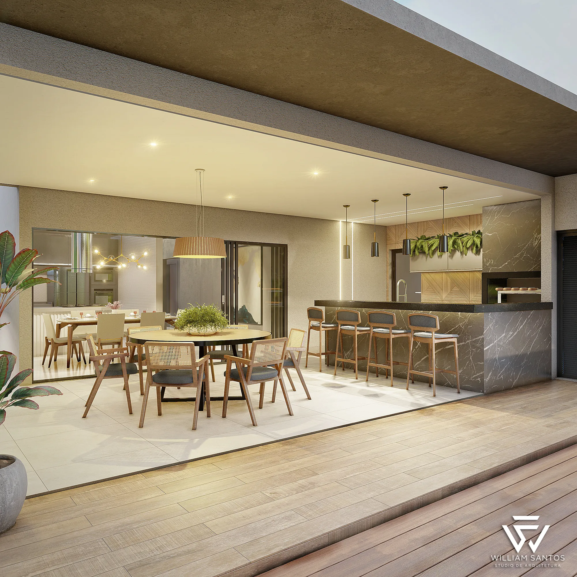 Área gourmet com bancada e mesa de jantar